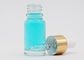 Warna Bening 15ml Bentuk Bulat Botol Kaca Kosmetik Dengan Emas Aluminium Dropper
